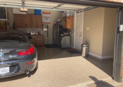 A garage with a car parked in it.