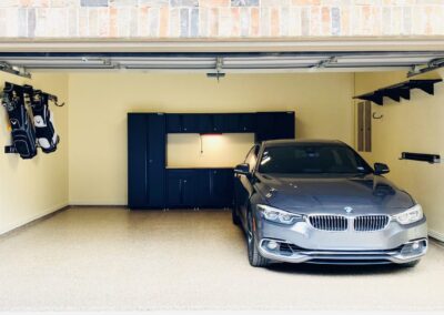 A garage with a bmw parked in it.