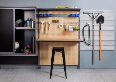 A garage with a workbench and tools.