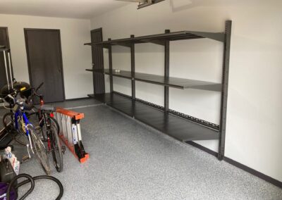 A garage with bike racks and shelves.